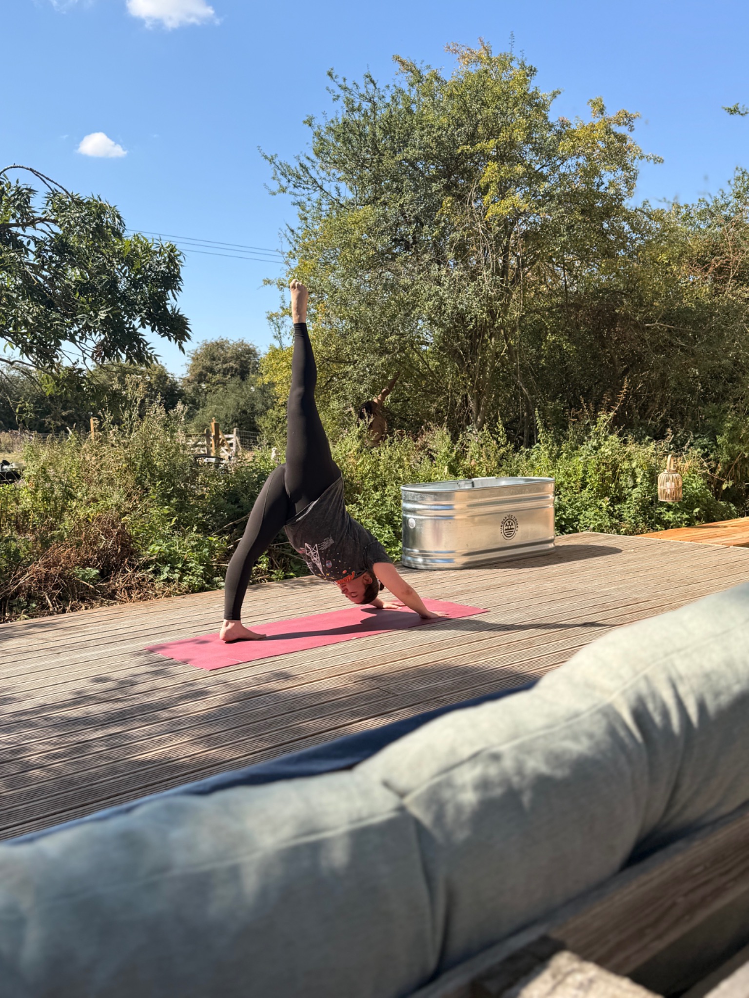 Yoga practice on The Hideaway deck beside the cold plunge